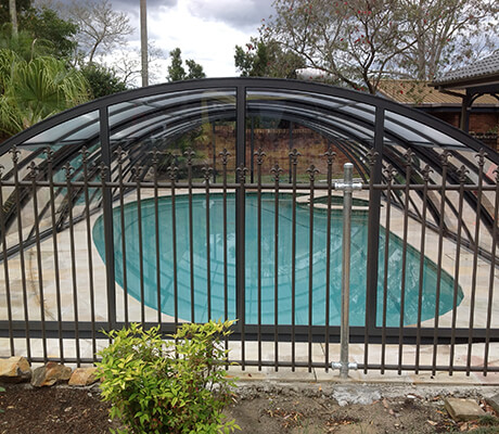 Photo of a swimming pool after a pool enclosure was installed