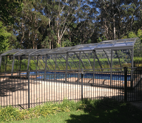 Photo of a pool after a swimming pool enclosure was installed