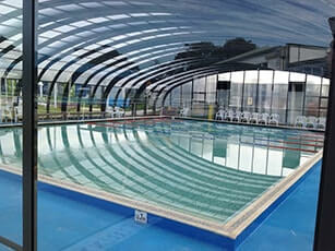 Photo of a Double-Grande Laguna commercial swimming pool enclosure