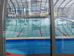 Photo of a Double-Grande Laguna commercial swimming pool enclosure