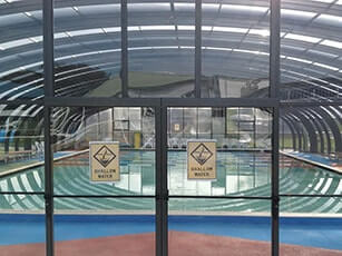 Photo of a Double-Grande Laguna commercial swimming pool enclosure