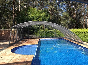 Photo of a Ravena High retractable pool enclosure