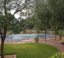 Photo of an Elegant Low swimming pool enclosure