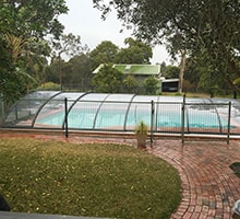Photo of an Elegant Low swimming pool enclosure
