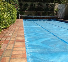 Photo of an Elegant Low swimming pool enclosure