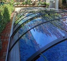Photo of an Elegant Low swimming pool enclosure