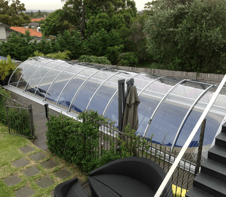 Photo of a swimming pool after a pool enclosure was installed