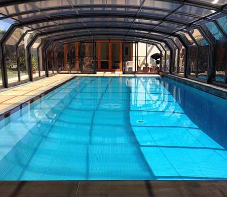Photo of a swimming pool after a pool enclosure was installed